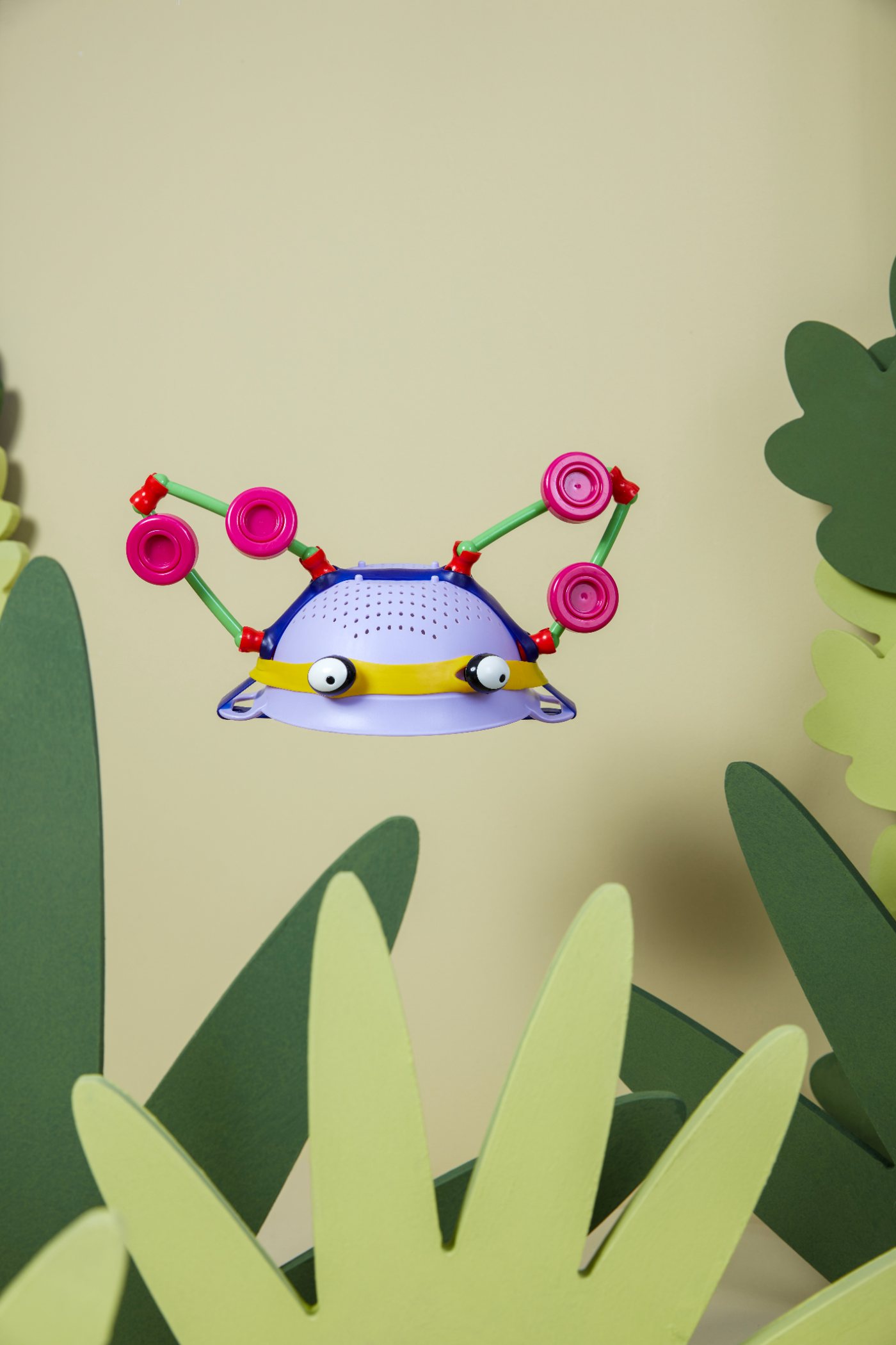 A crab made from a purple colander