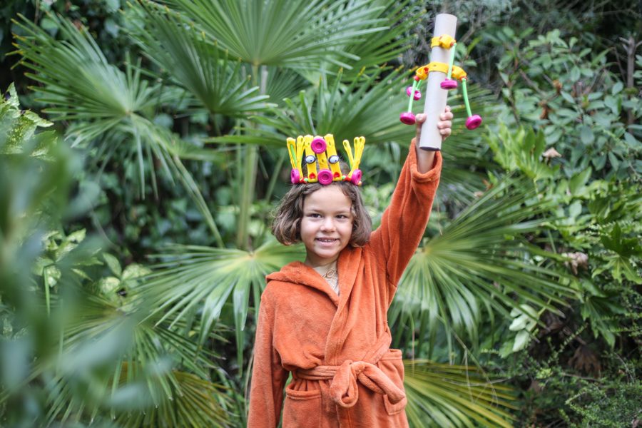 A child wearing a fox she made with Toyi