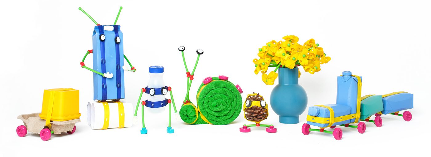 Toys kids made by combining Toyi pieces with bottles, cups and boxes